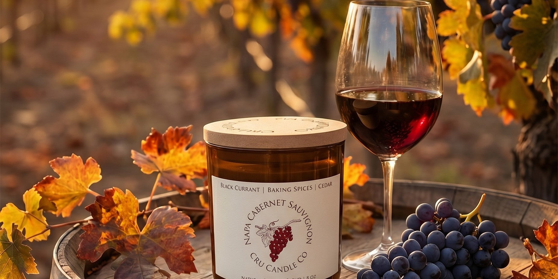 Cru Candle Co Napa Cabernet candle in a vineyard at golden hour