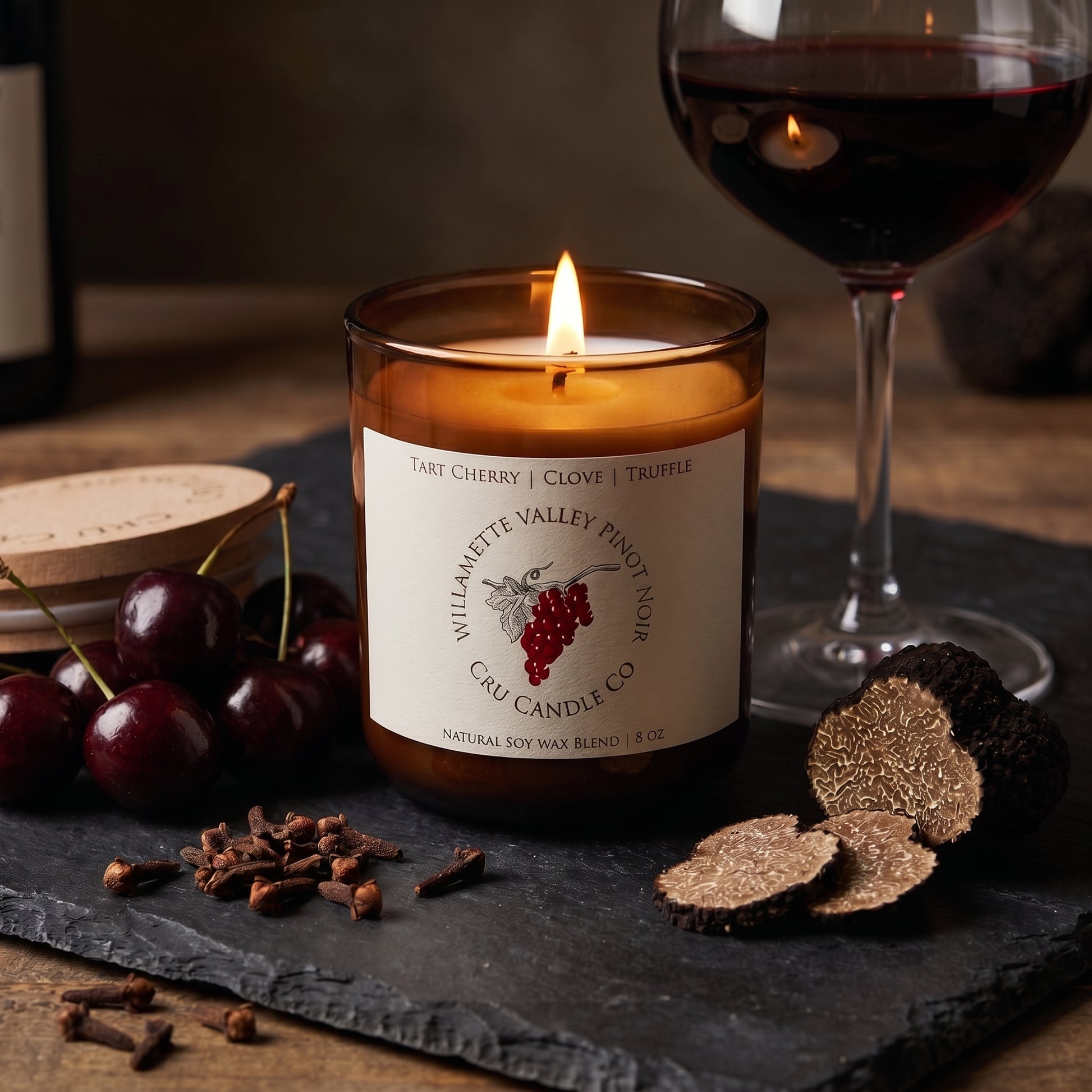 Willamette Valley Pinot Noir candle styled with cherries, truffle and red wine