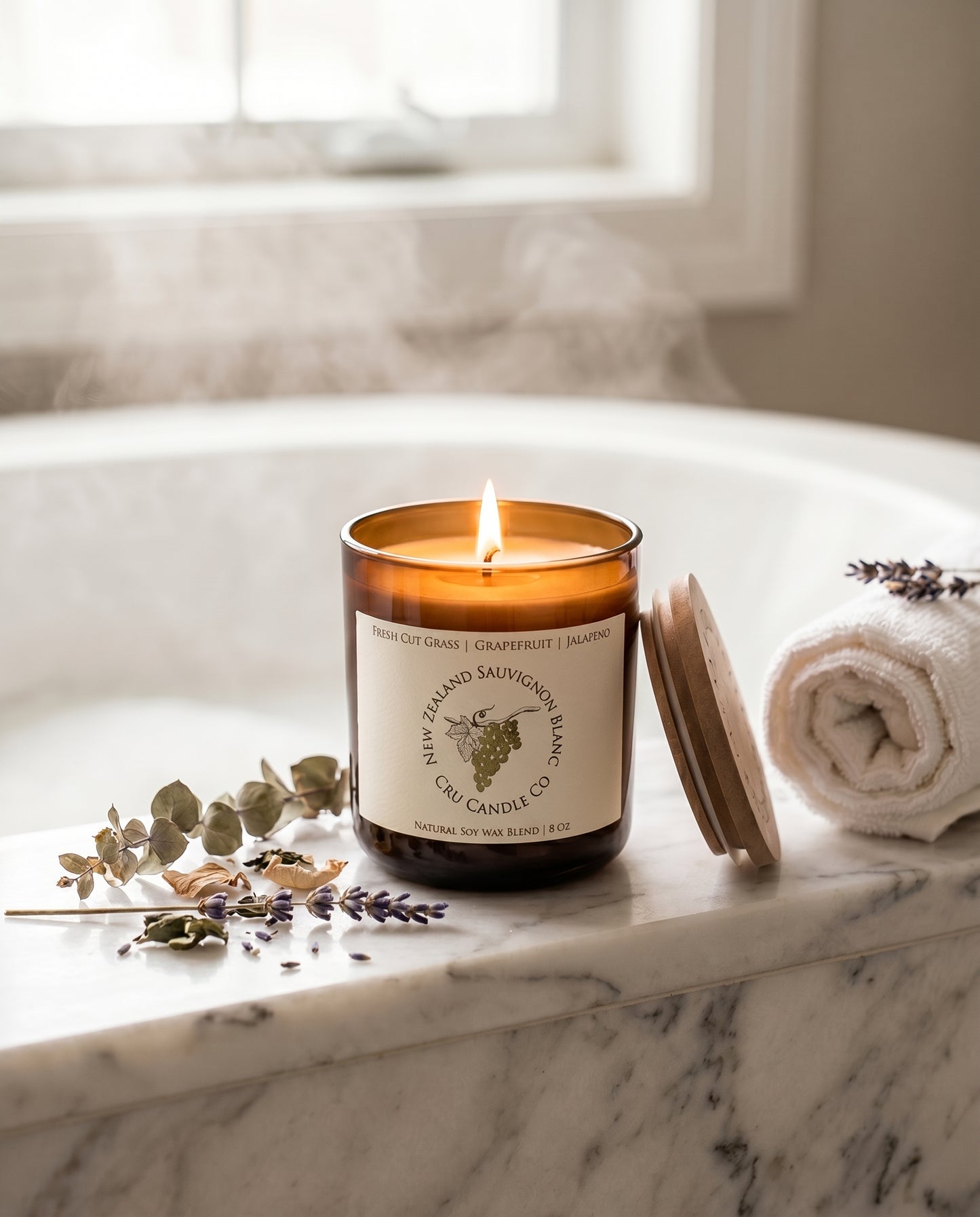 New Zealand Sauvignon Blanc candle styled on marble with eucalyptus and lavender
